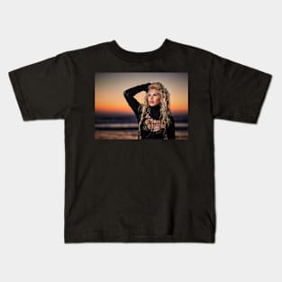 Beautiful woman on the beach at sunrise Kids T-Shirt